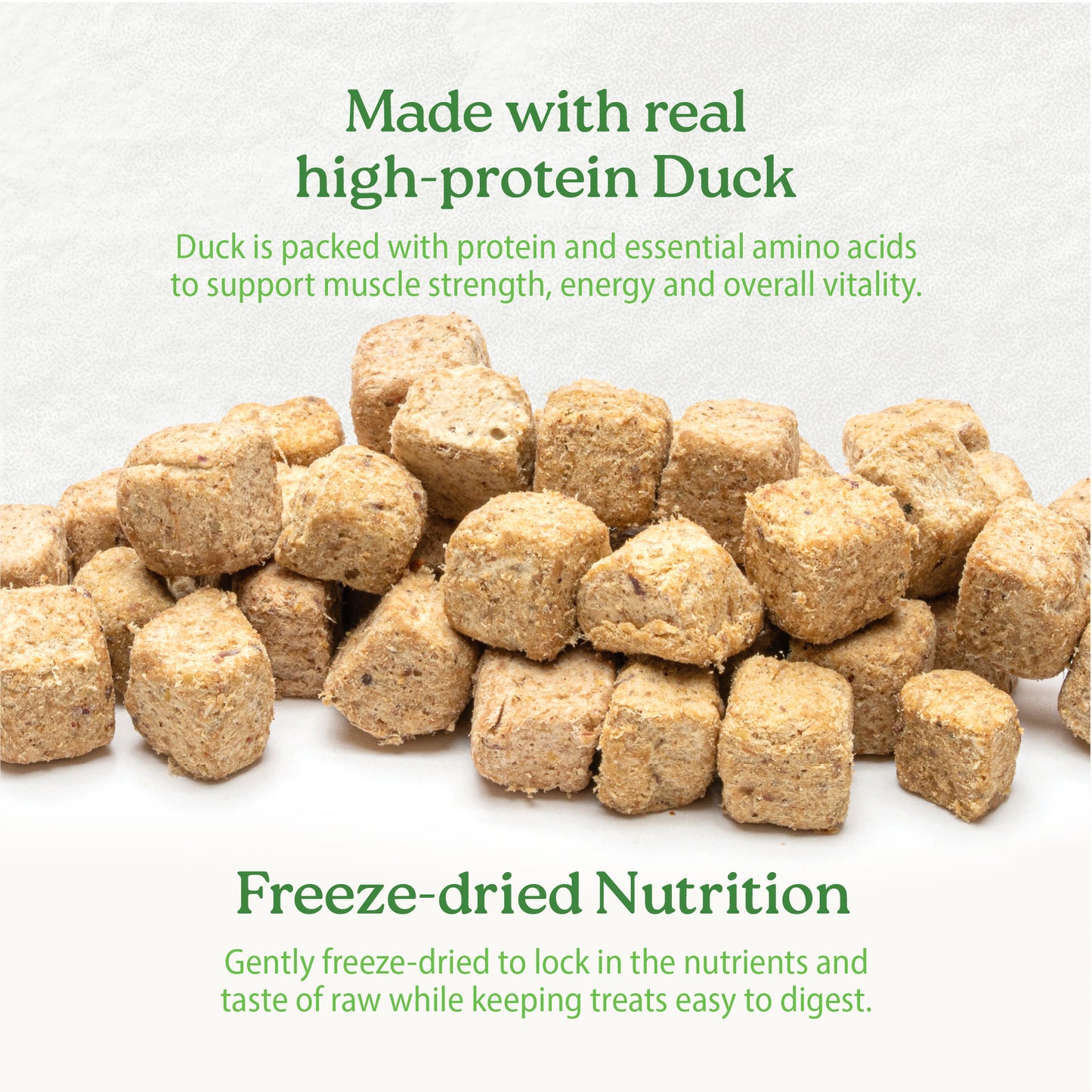
                        
                          Several brown, cube-shaped Caledon Farms Duck Bites + Daily Essentials 240g treats are scattered on a light surface. Above: "Made with real high-protein Duck." Below: "Supports skin, coat health, and digestive benefits.
                        
                      